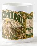 Coffee mug featuring vintage green-and-gold Gemini artwork with celestial twins, floral borders, sun and moon motifs, and a playful zodiac personality recipe.
